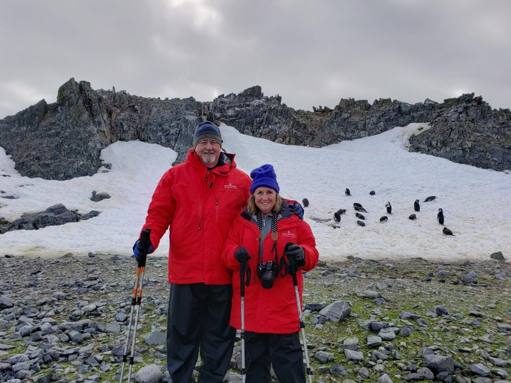 Madeline and Paul with Chinstrap Penguins, Half Moon Island, South Shetland Islands, Antarctica
